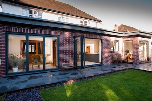 REAL Aluminium bi-fold doors installed as part of a home extension